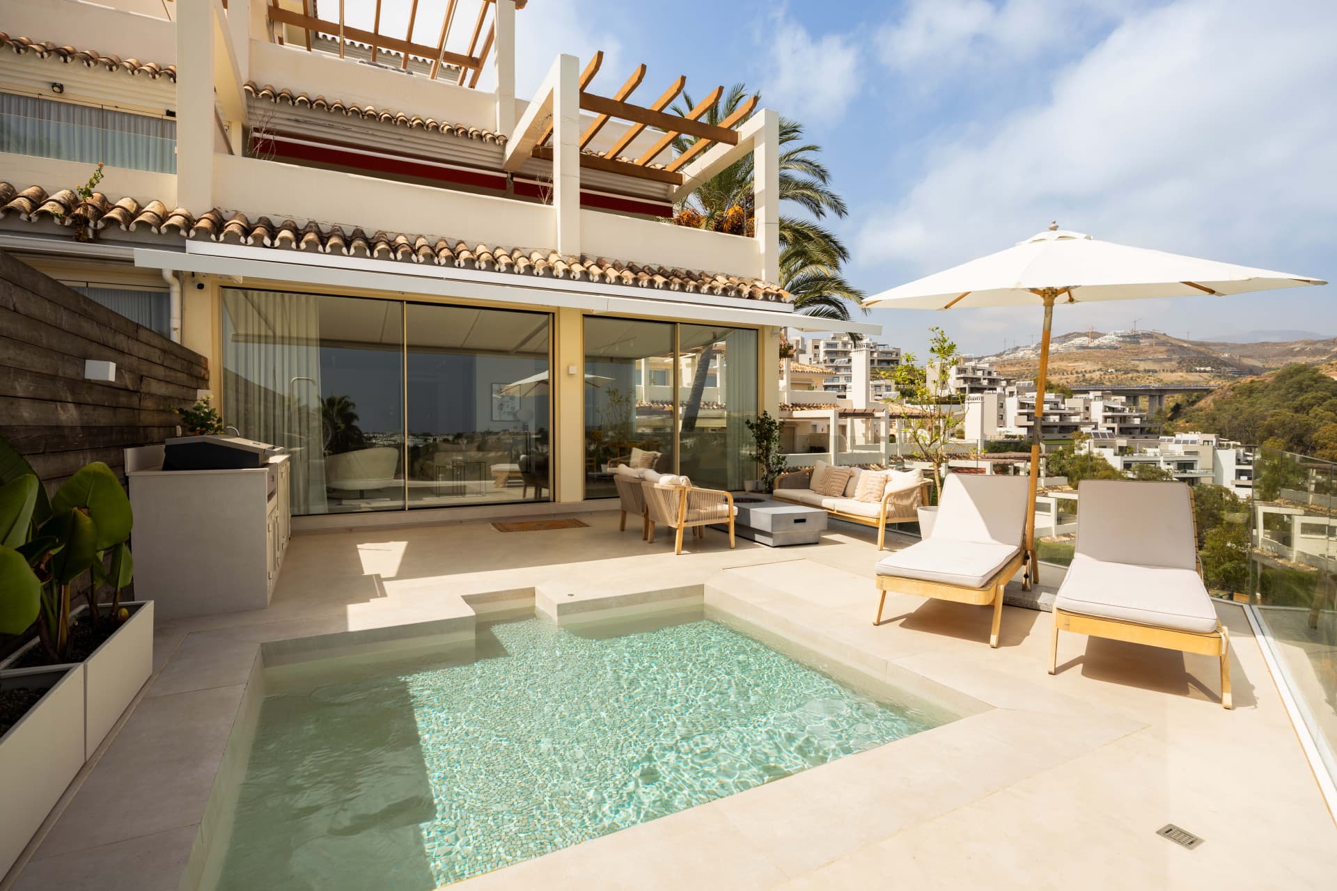 Panoramic sea, lake and La Concha views meet modern design, a private plunge pool and stylish outdoor living in Les Belvederes, Nueva Andalucia.