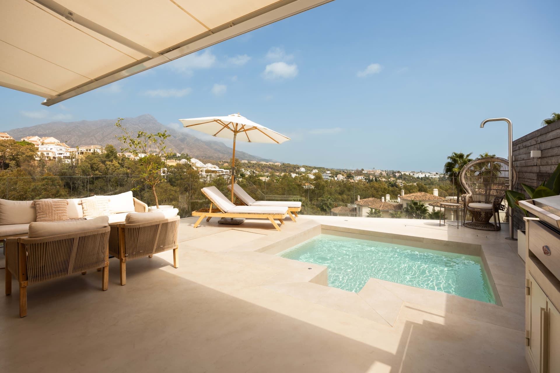 Panoramic sea, lake and La Concha views meet modern design, a private plunge pool and stylish outdoor living in Les Belvederes, Nueva Andalucia.