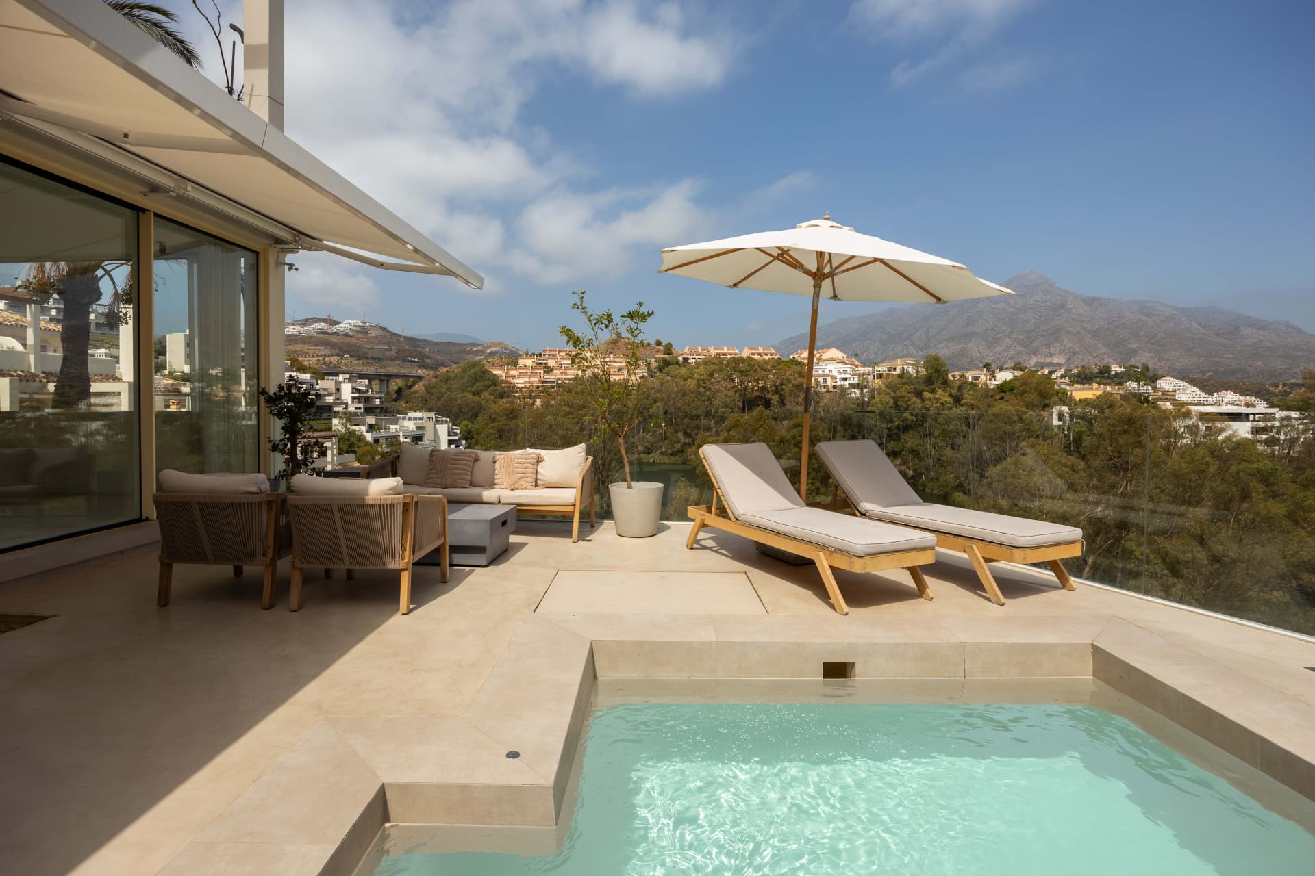Panoramic sea, lake and La Concha views meet modern design, a private plunge pool and stylish outdoor living in Les Belvederes, Nueva Andalucia.