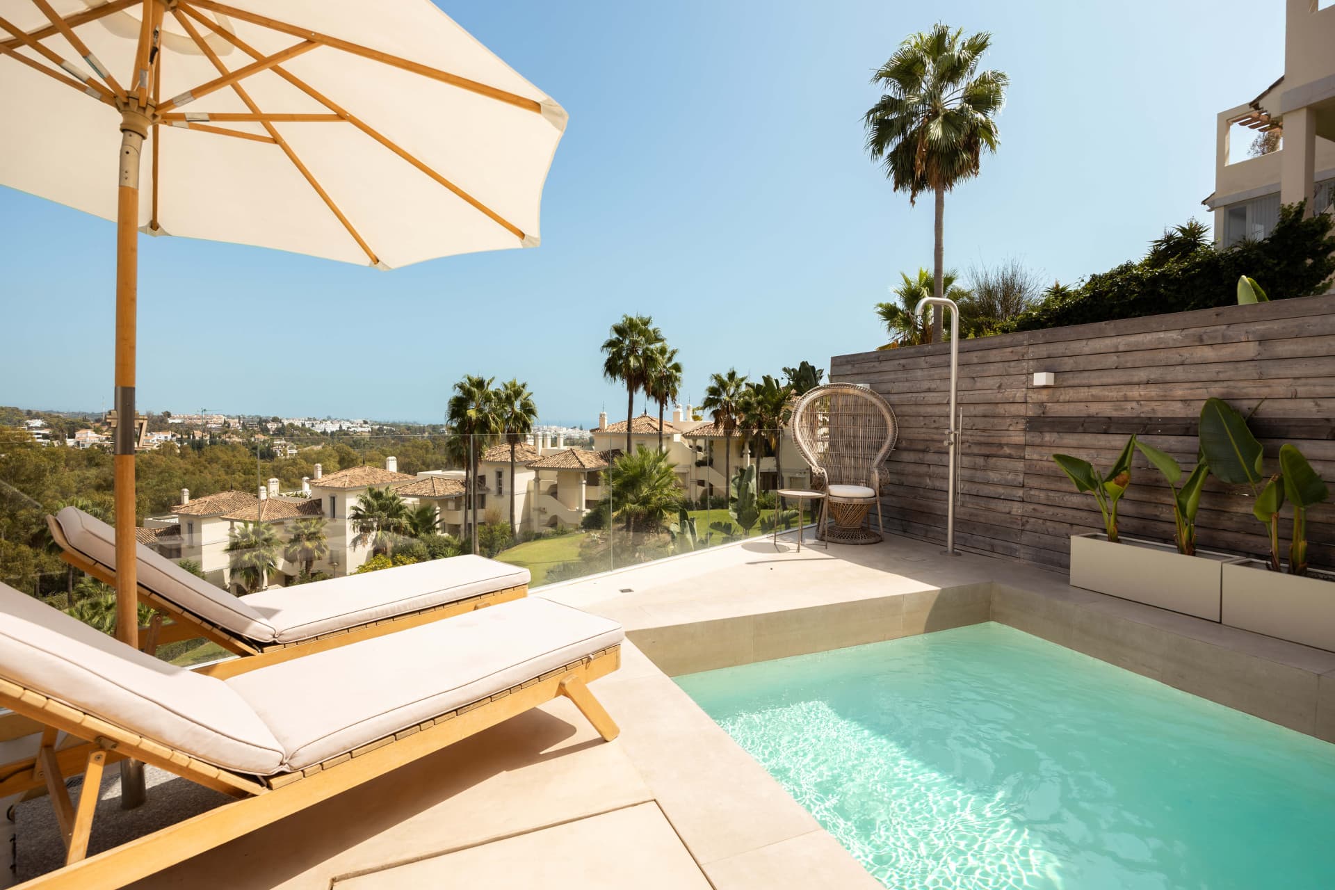 Panoramic sea, lake and La Concha views meet modern design, a private plunge pool and stylish outdoor living in Les Belvederes, Nueva Andalucia.