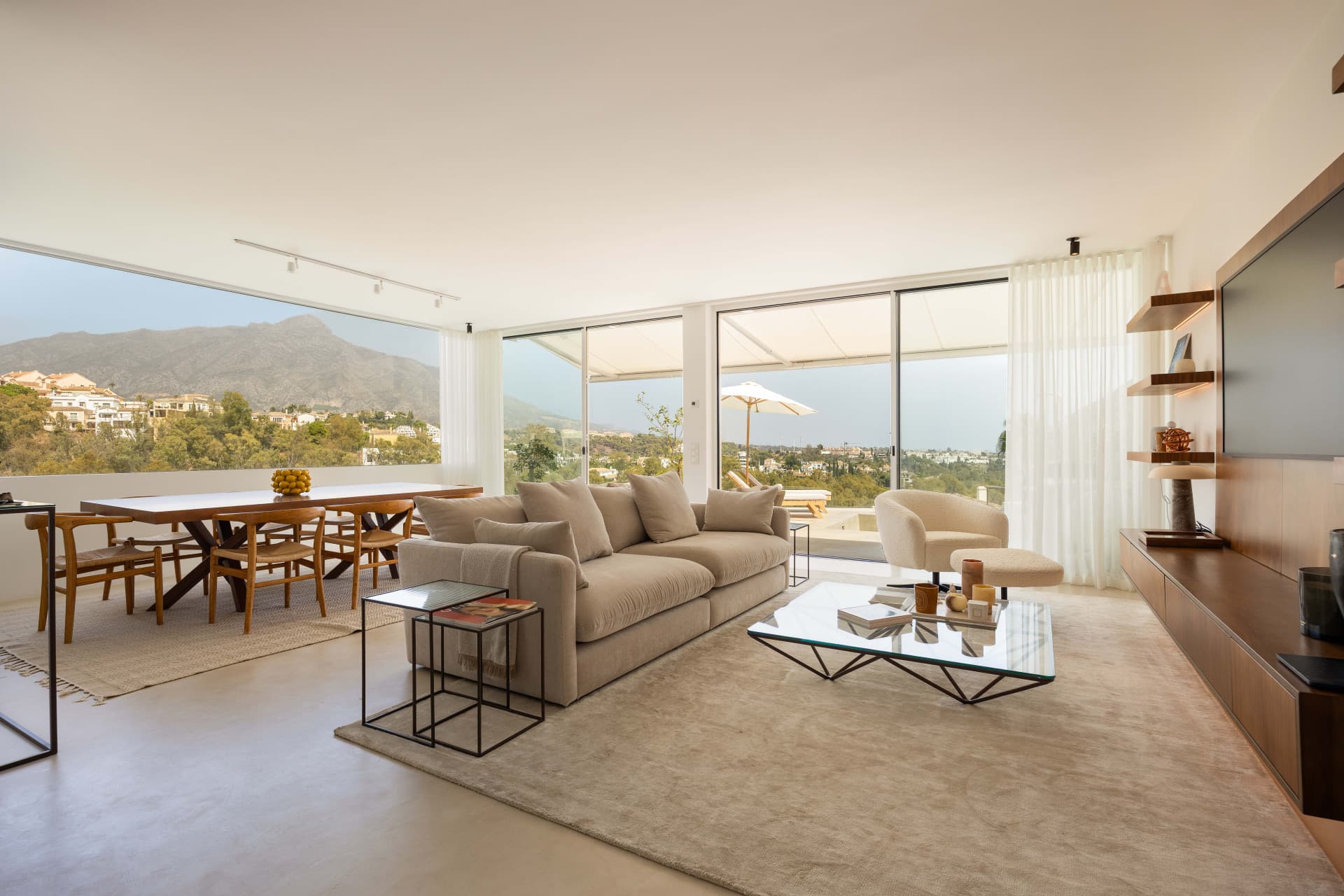 Panoramic sea, lake and La Concha views meet modern design, a private plunge pool and stylish outdoor living in Les Belvederes, Nueva Andalucia.