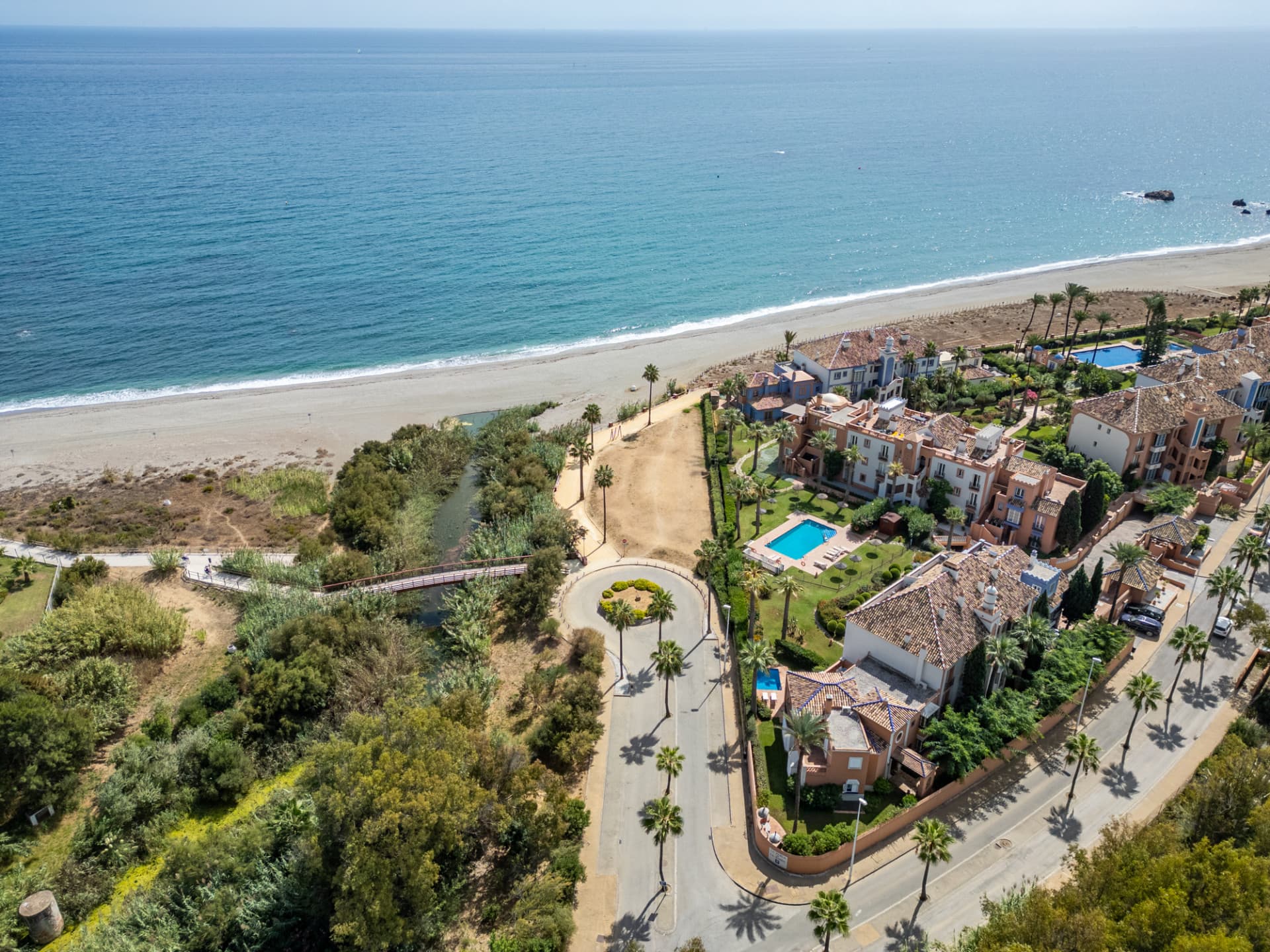 One of only three beachfront villas in La Perla de la Bahía!