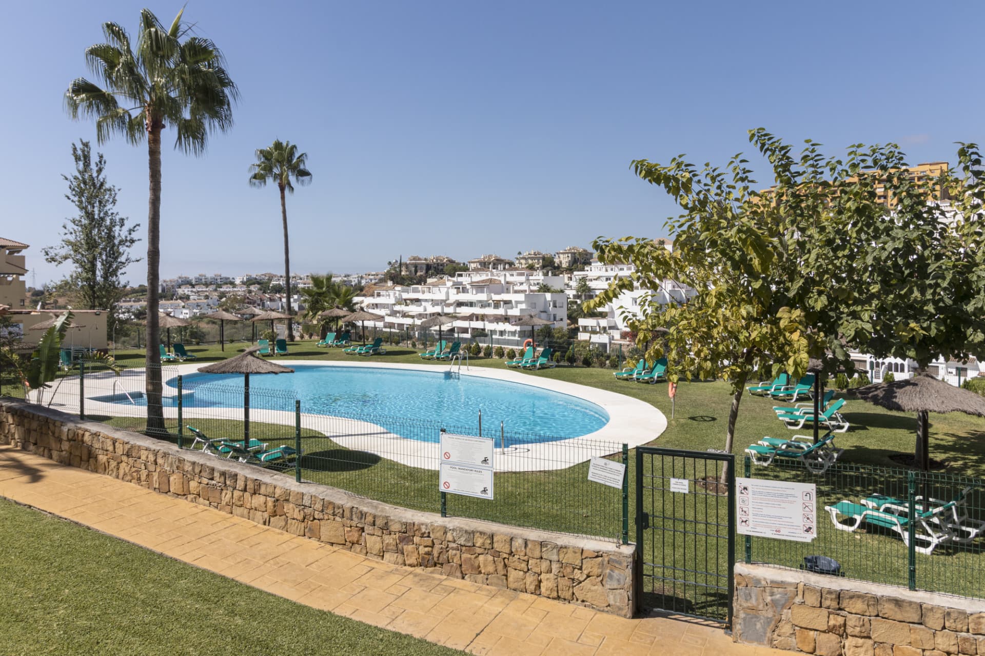 This ground-floor apartment, although it has an upper level and a large terrace