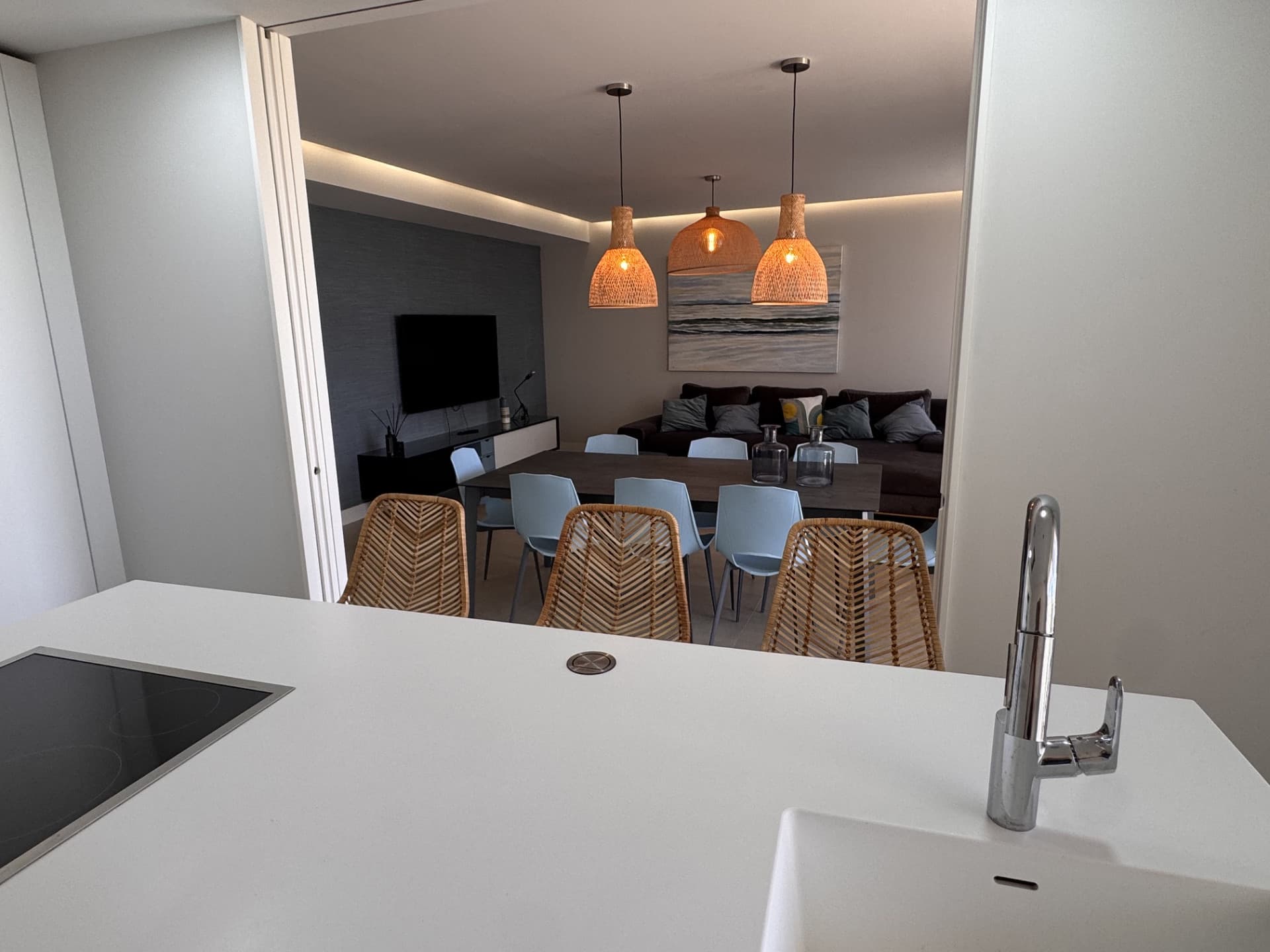 This elegant ground-floor apartment offers a refined coastal lifestyle within an exclusive beachfront setting