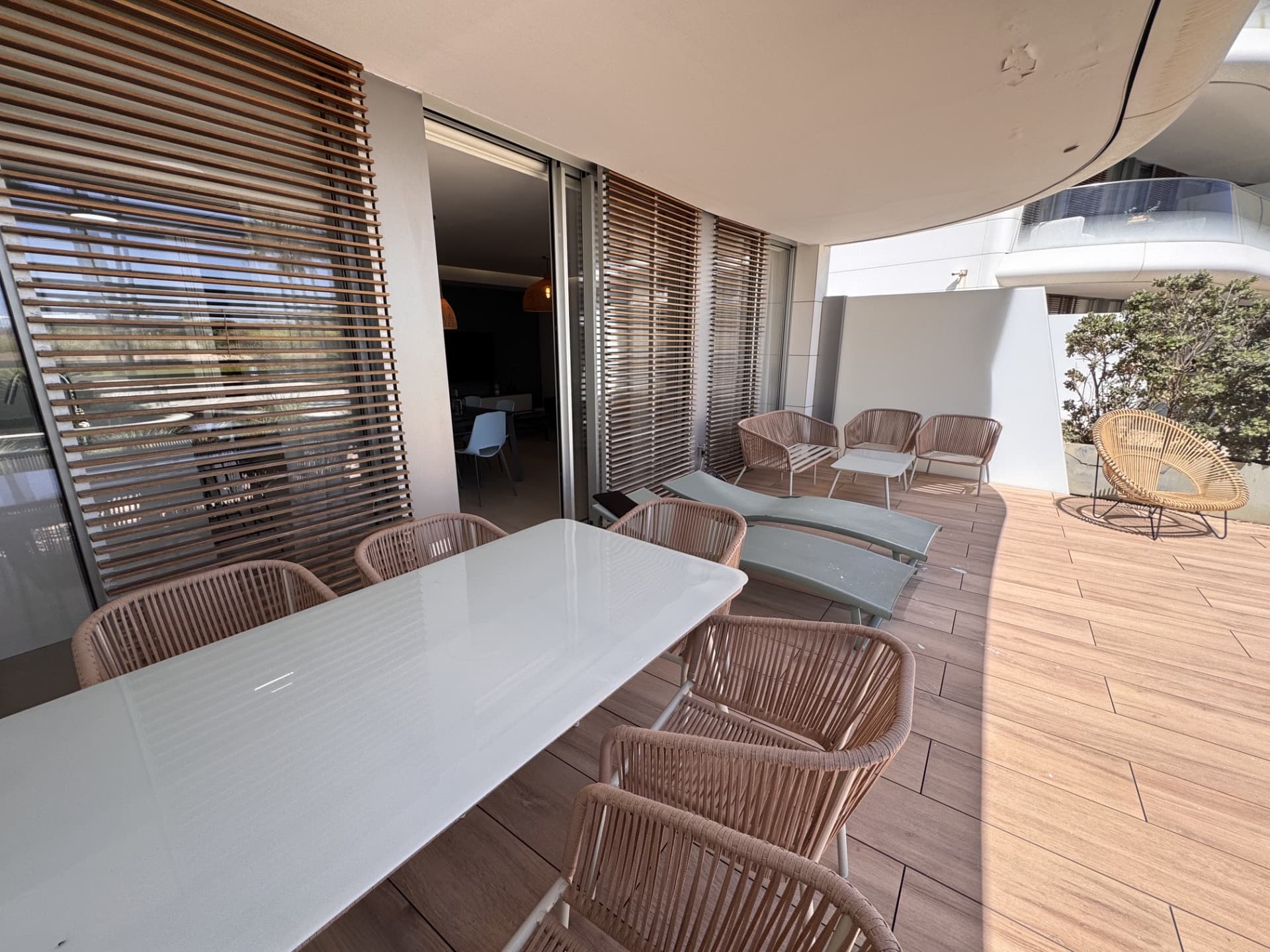 This elegant ground-floor apartment offers a refined coastal lifestyle within an exclusive beachfront setting