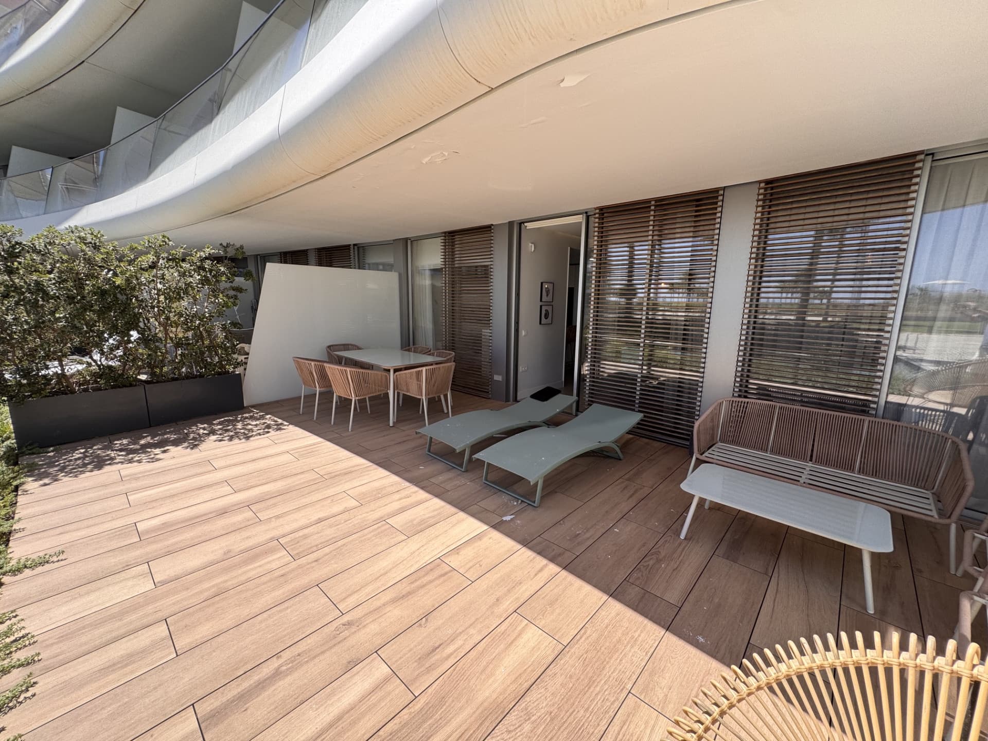 This elegant ground-floor apartment offers a refined coastal lifestyle within an exclusive beachfront setting