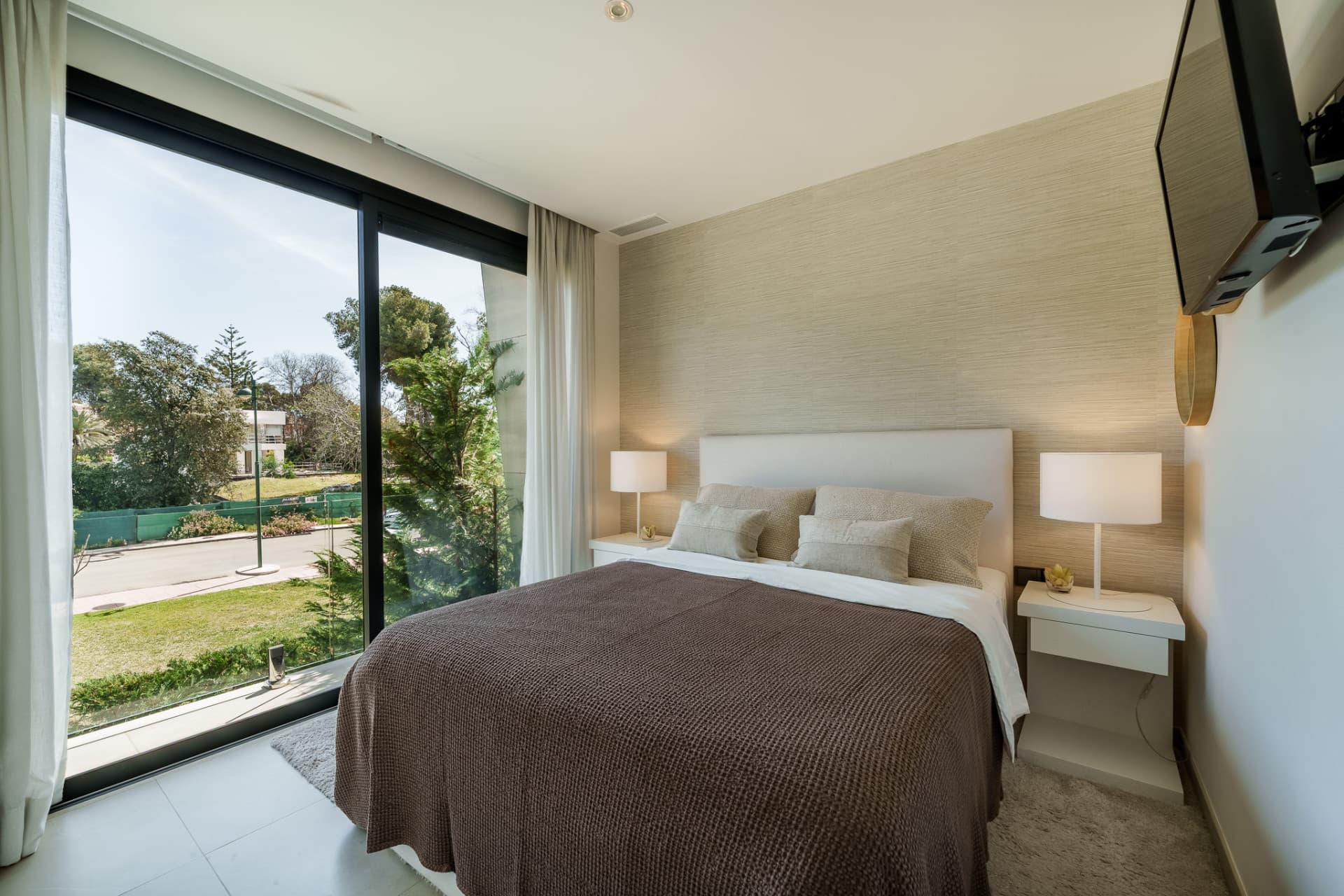 Contemporary Elegance by the Sea in Bahía de Banús This sophisticated, contemporary semi-detached villa is located in Ba