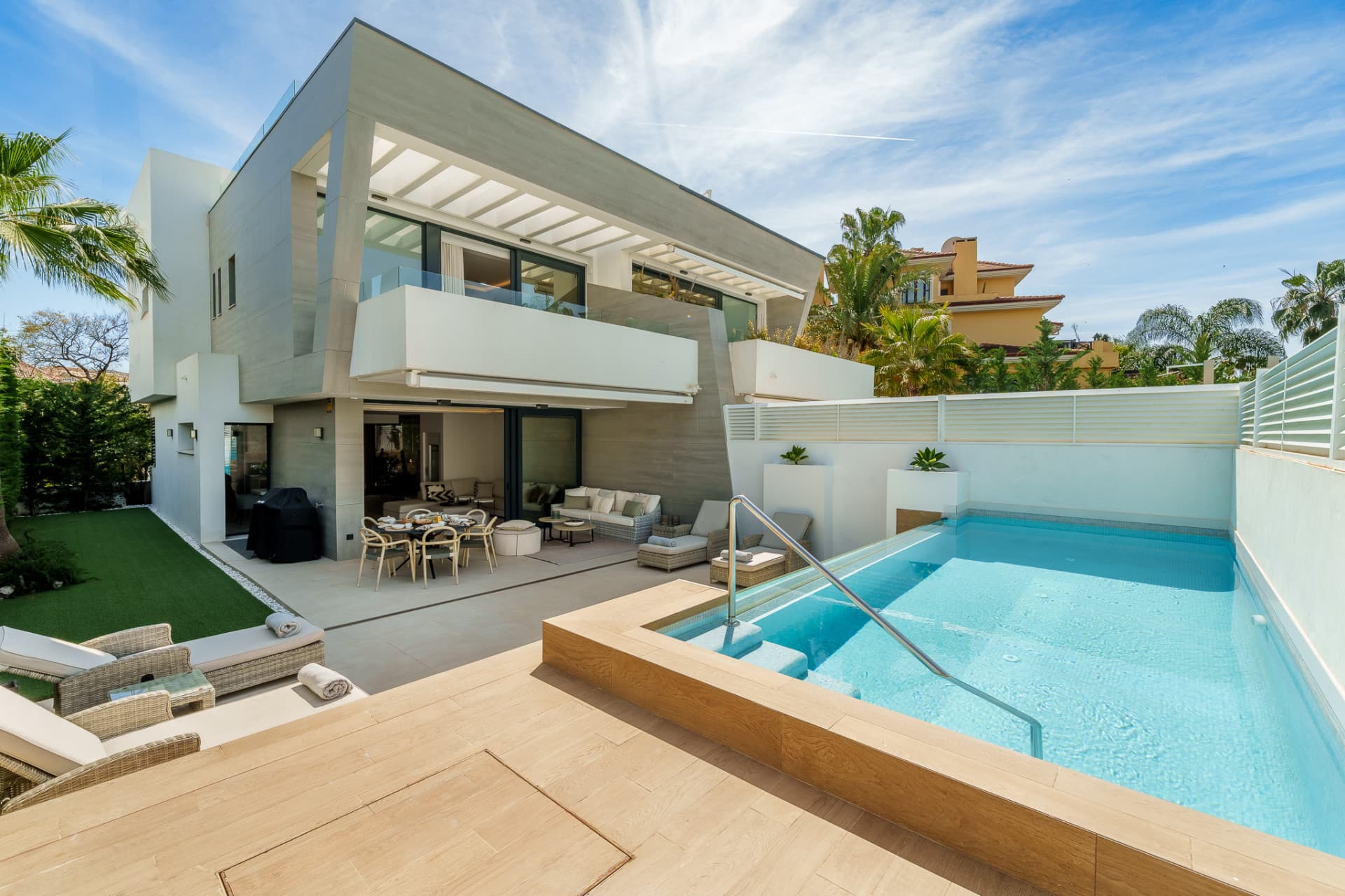 Contemporary Elegance by the Sea in Bahía de Banús This sophisticated, contemporary semi-detached villa is located in Ba