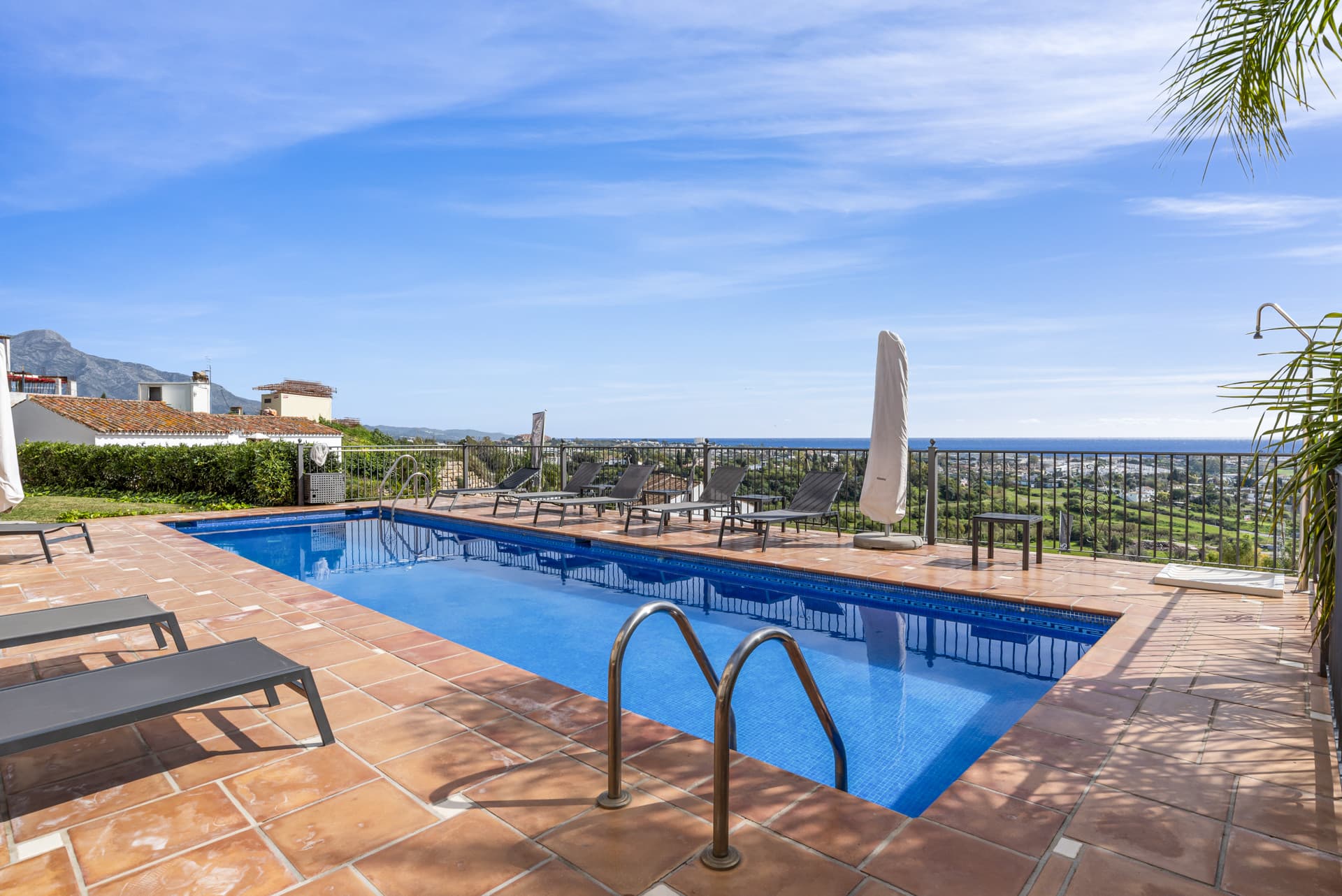 Located in the exclusive and tranquil gated community of Los Almendros, this outstanding south-facing duplex penthouse o