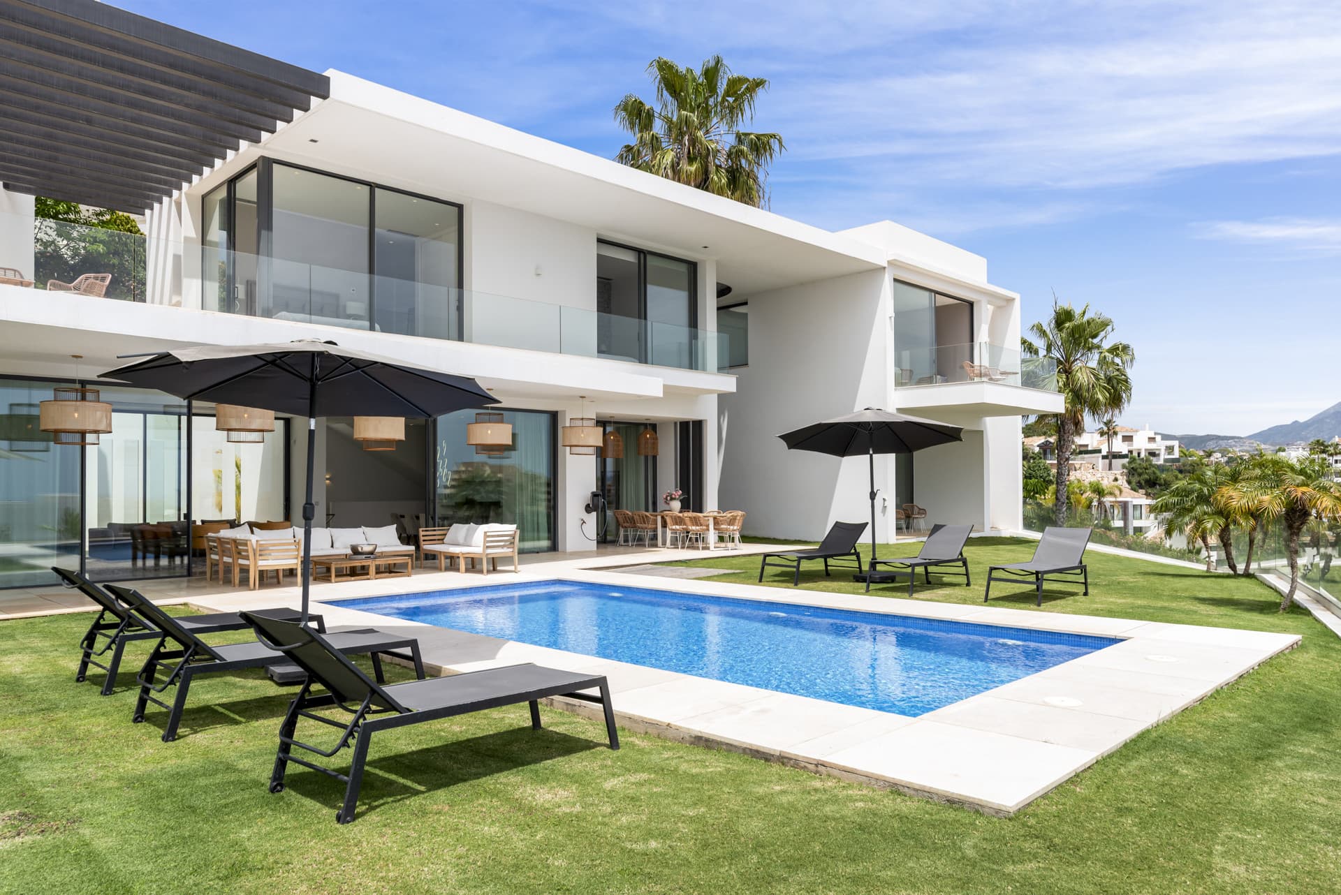 Sophisticated Villa With Panoramic Vistas and Lush Greenery Set in the prestigious enclave of La Alquería in Benahavís,