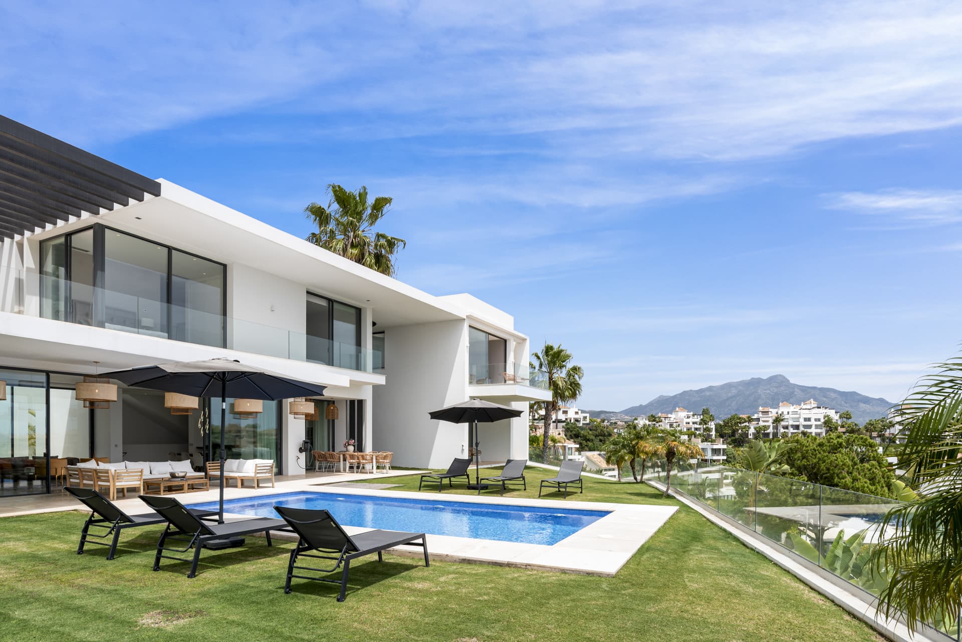 Sophisticated Villa With Panoramic Vistas and Lush Greenery Set in the prestigious enclave of La Alquería in Benahavís,