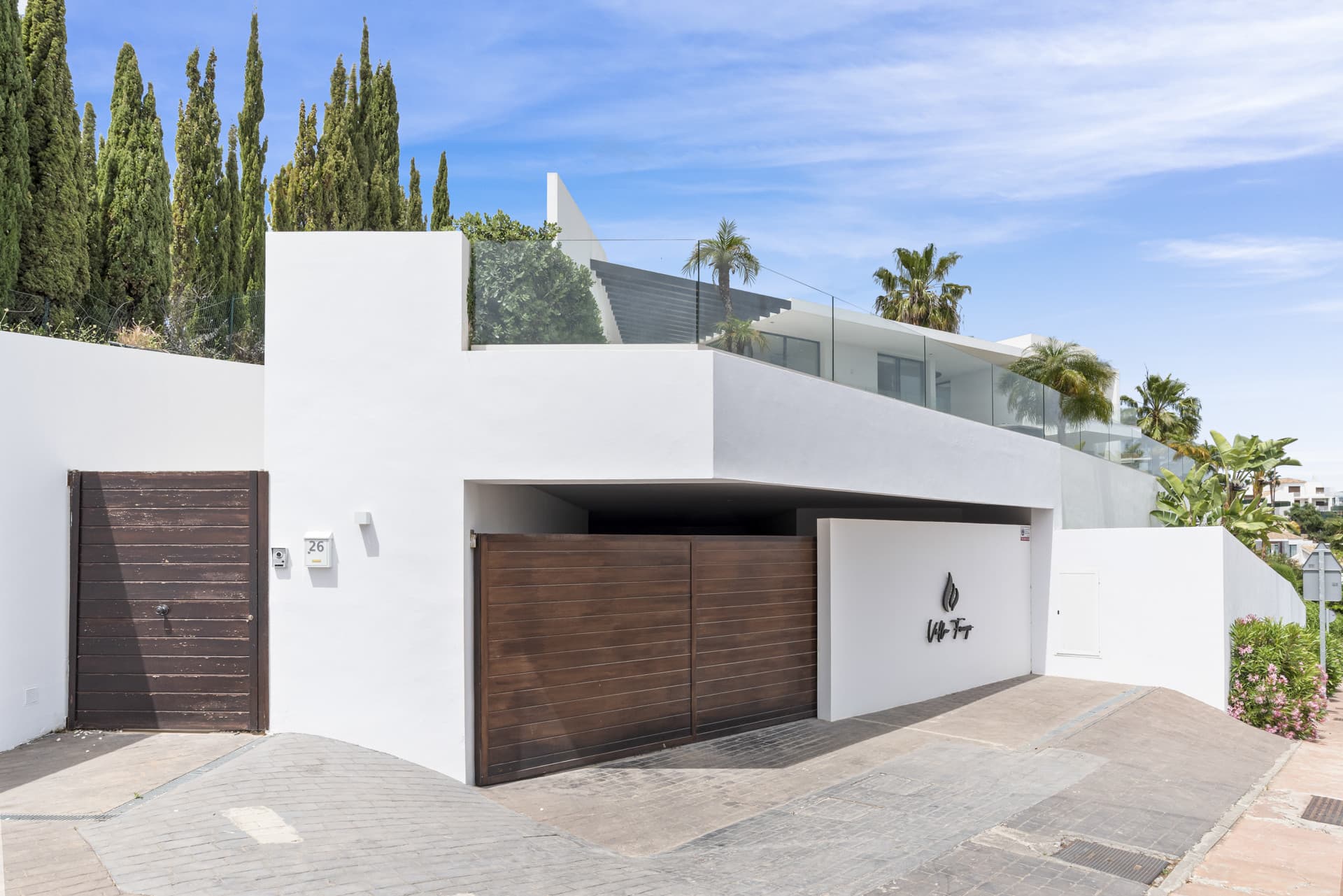 Sophisticated Villa With Panoramic Vistas and Lush Greenery Set in the prestigious enclave of La Alquería in Benahavís,