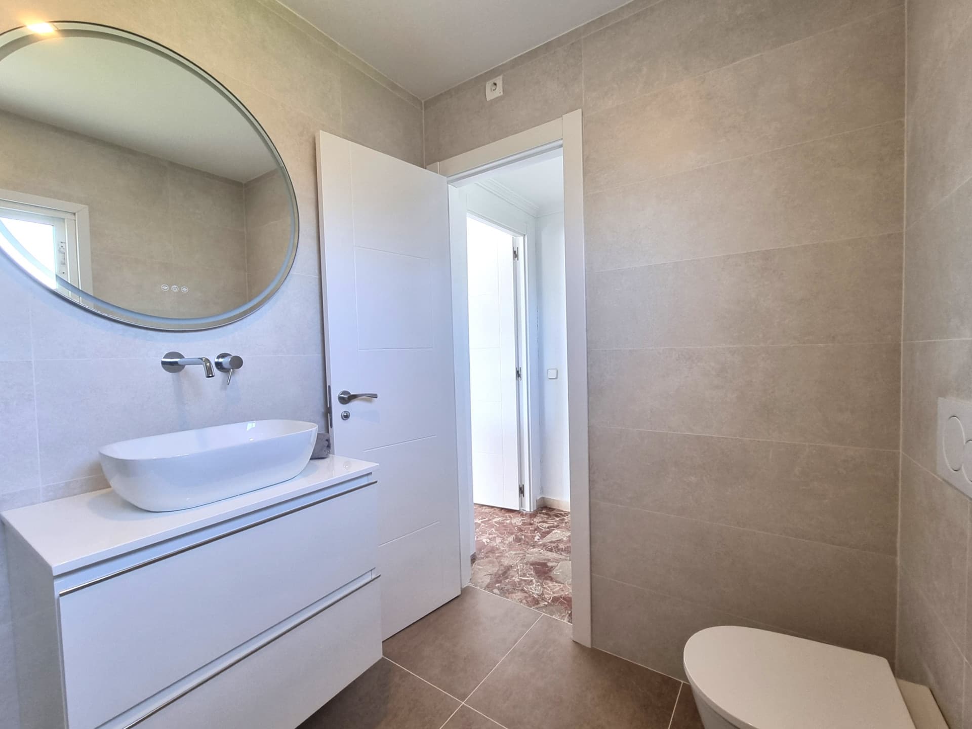 This exclusive 4th-floor apartment is a true coastal sanctuary, offering uninterrupted sea views and direct access to pristine beaches and lush communal gardens.