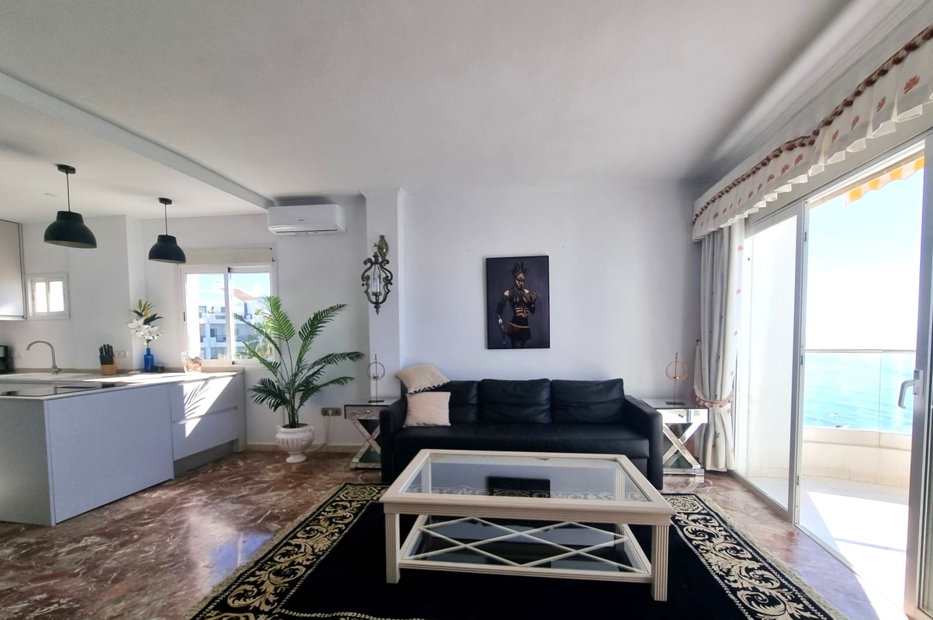 This exclusive 4th-floor apartment is a true coastal sanctuary, offering uninterrupted sea views and direct access to pristine beaches and lush communal gardens.
