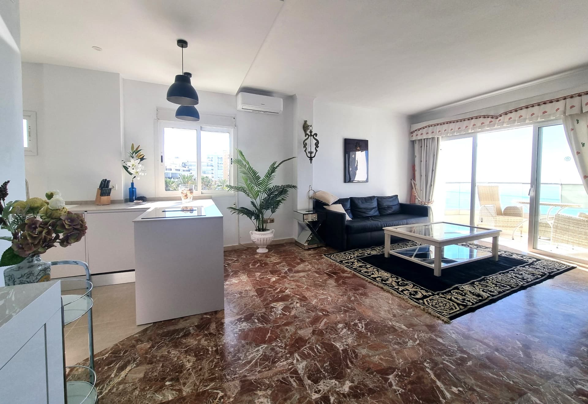 This exclusive 4th-floor apartment is a true coastal sanctuary, offering uninterrupted sea views and direct access to pristine beaches and lush communal gardens.