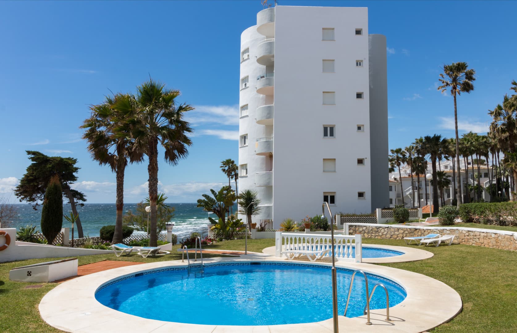 This exclusive 4th-floor apartment is a true coastal sanctuary, offering uninterrupted sea views and direct access to pristine beaches and lush communal gardens.