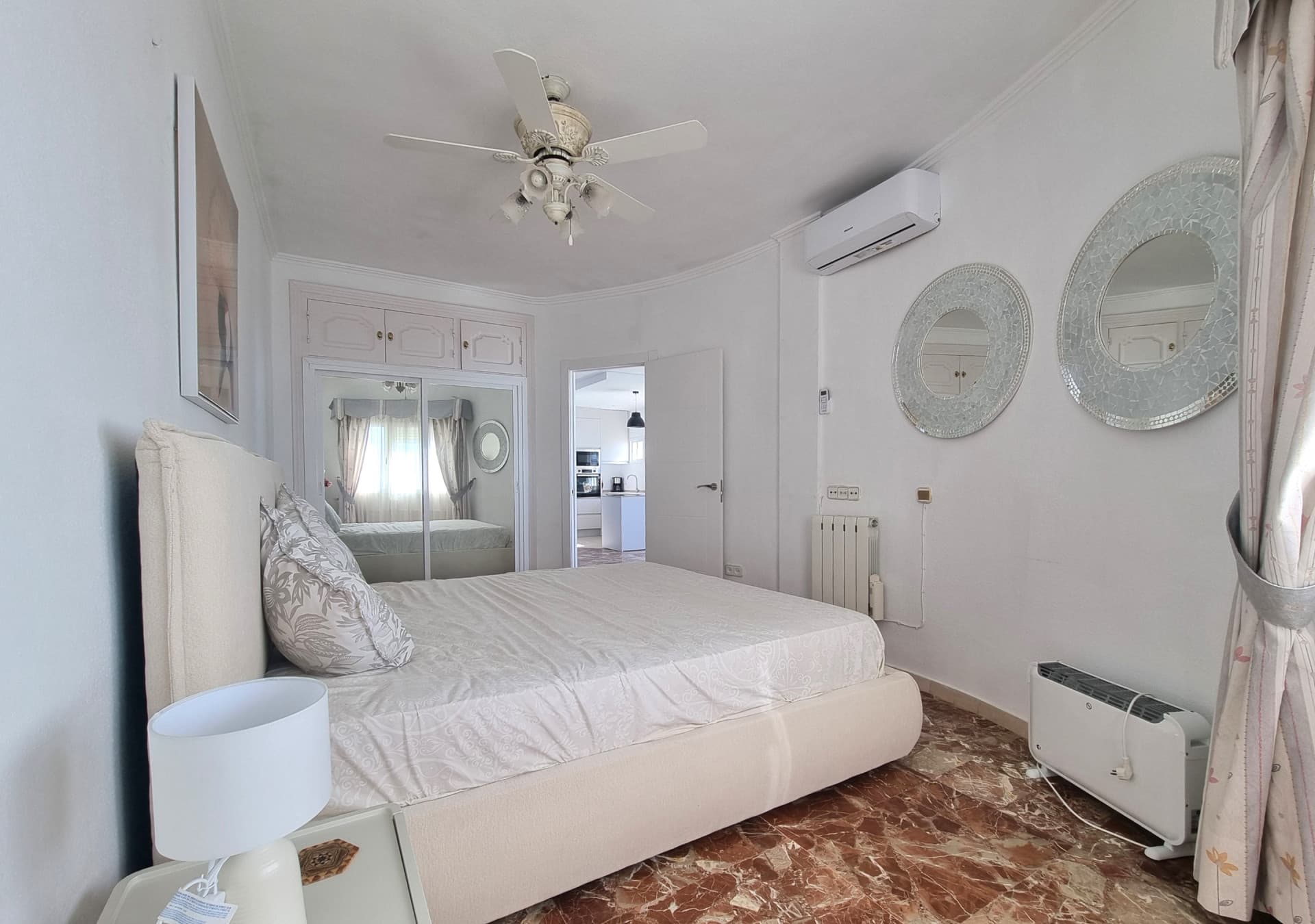 This exclusive 4th-floor apartment is a true coastal sanctuary, offering uninterrupted sea views and direct access to pristine beaches and lush communal gardens.