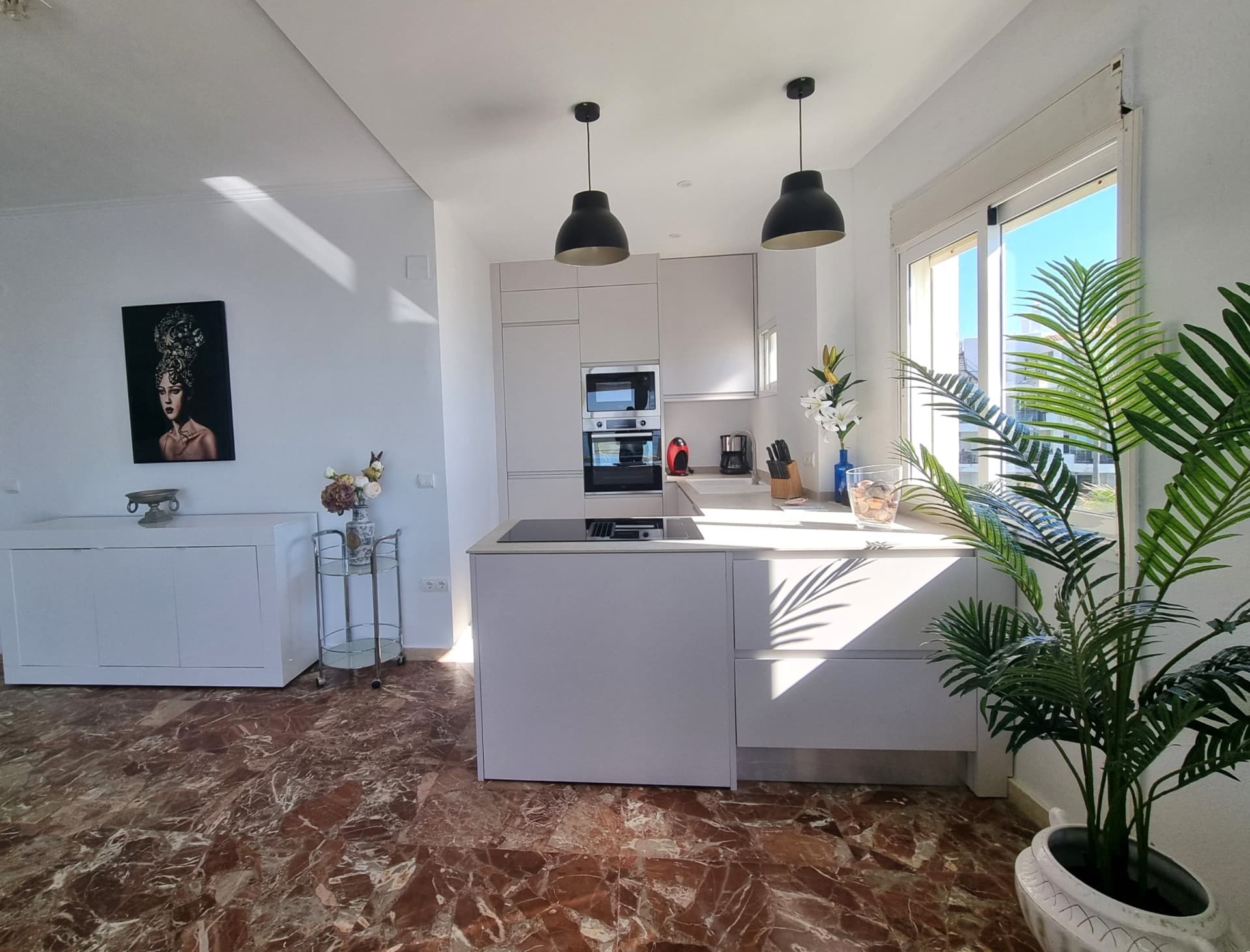 This exclusive 4th-floor apartment is a true coastal sanctuary, offering uninterrupted sea views and direct access to pristine beaches and lush communal gardens.