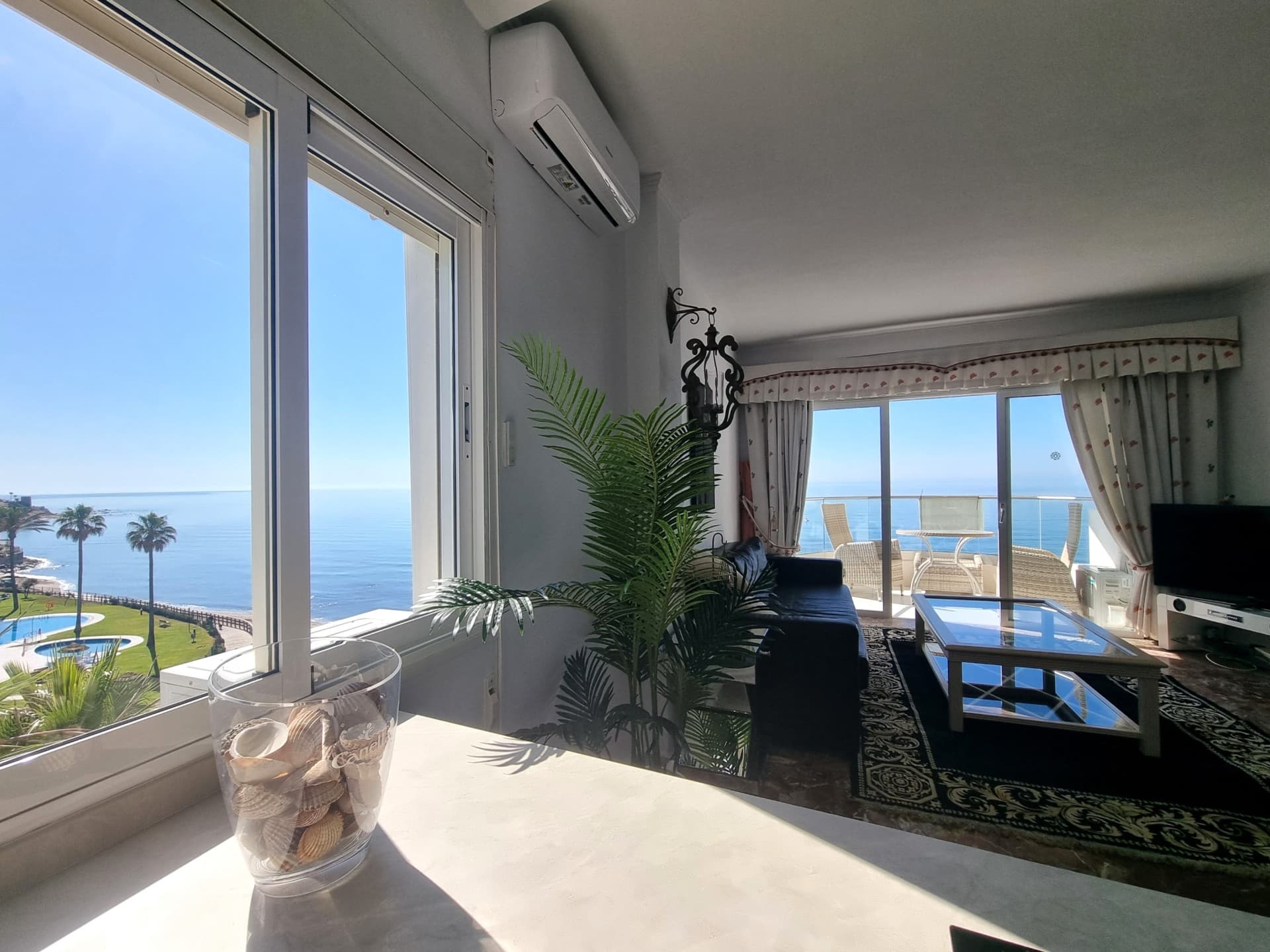 This exclusive 4th-floor apartment is a true coastal sanctuary, offering uninterrupted sea views and direct access to pristine beaches and lush communal gardens.