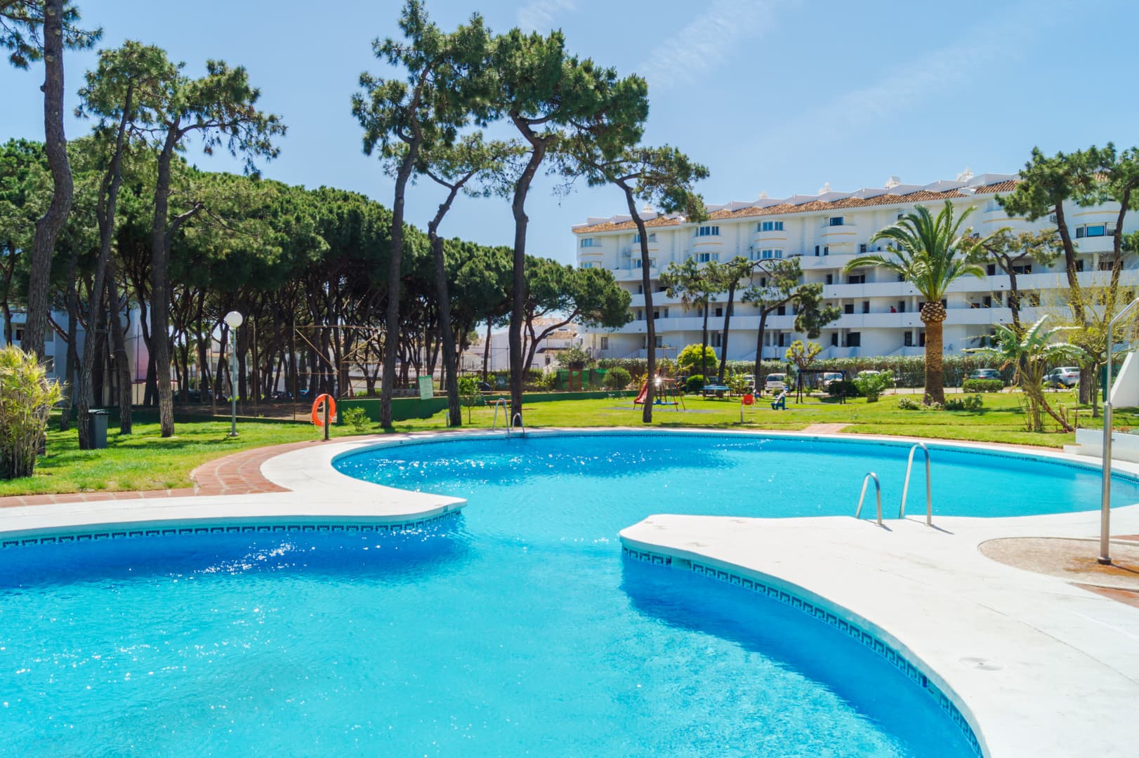 This exclusive 4th-floor apartment is a true coastal sanctuary, offering uninterrupted sea views and direct access to pristine beaches and lush communal gardens.