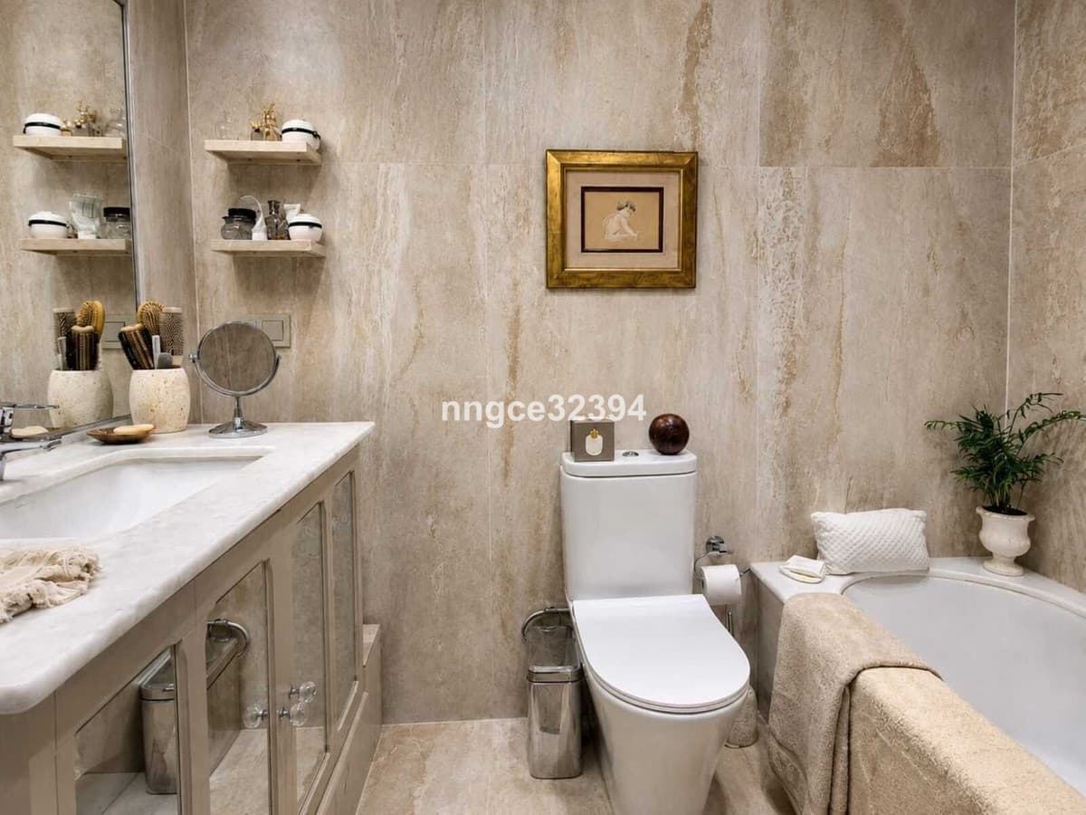 Top-Floor Designer Apartment on Marbella's Golden Mile | Sea Views, Terrace, Garage & Storage