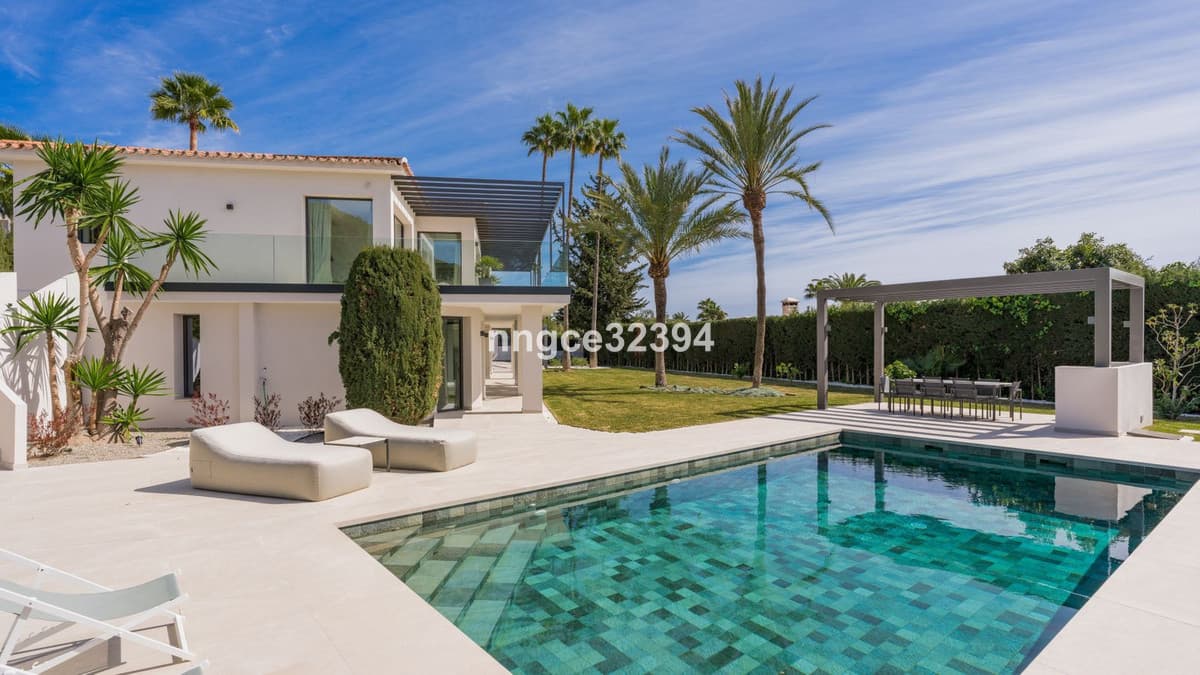Sophisticated Modern Villa with Panoramic Views on Marbella's Golden Mile This exceptional five-bedroom villa, located o