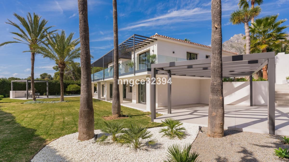 Sophisticated Modern Villa with Panoramic Views on Marbella's Golden Mile This exceptional five-bedroom villa, located o