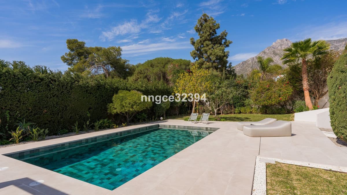 Sophisticated Modern Villa with Panoramic Views on Marbella's Golden Mile This exceptional five-bedroom villa, located o