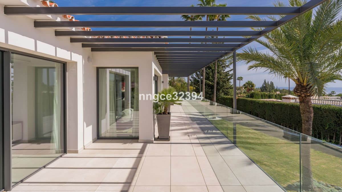 Sophisticated Modern Villa with Panoramic Views on Marbella's Golden Mile This exceptional five-bedroom villa, located o