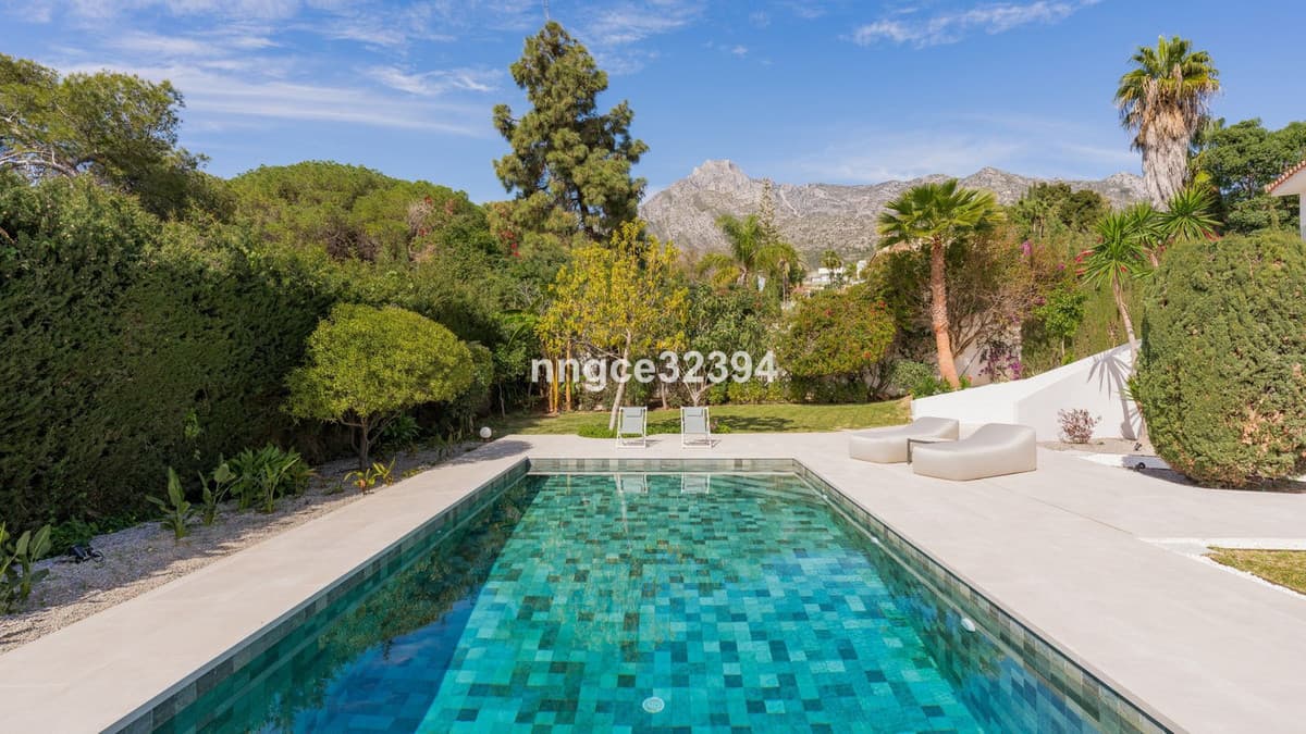 Sophisticated Modern Villa with Panoramic Views on Marbella's Golden Mile This exceptional five-bedroom villa, located o