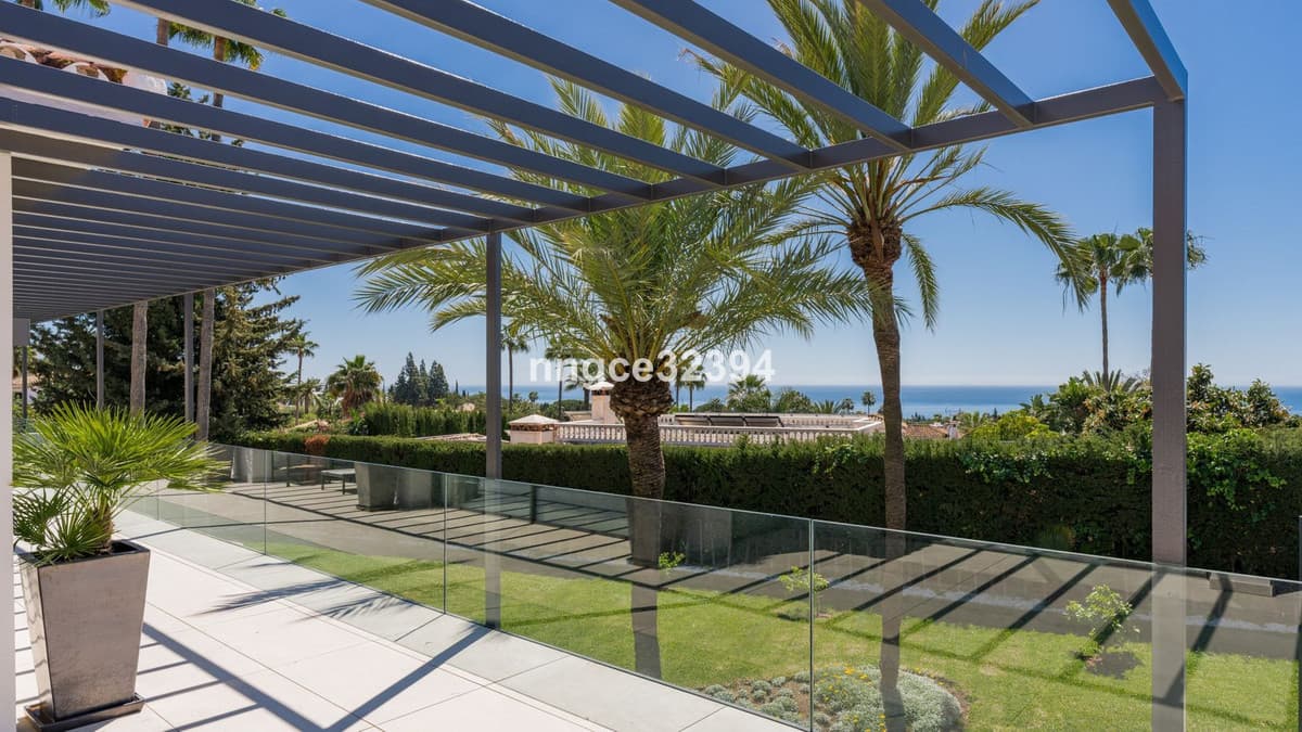 Sophisticated Modern Villa with Panoramic Views on Marbella's Golden Mile This exceptional five-bedroom villa, located o