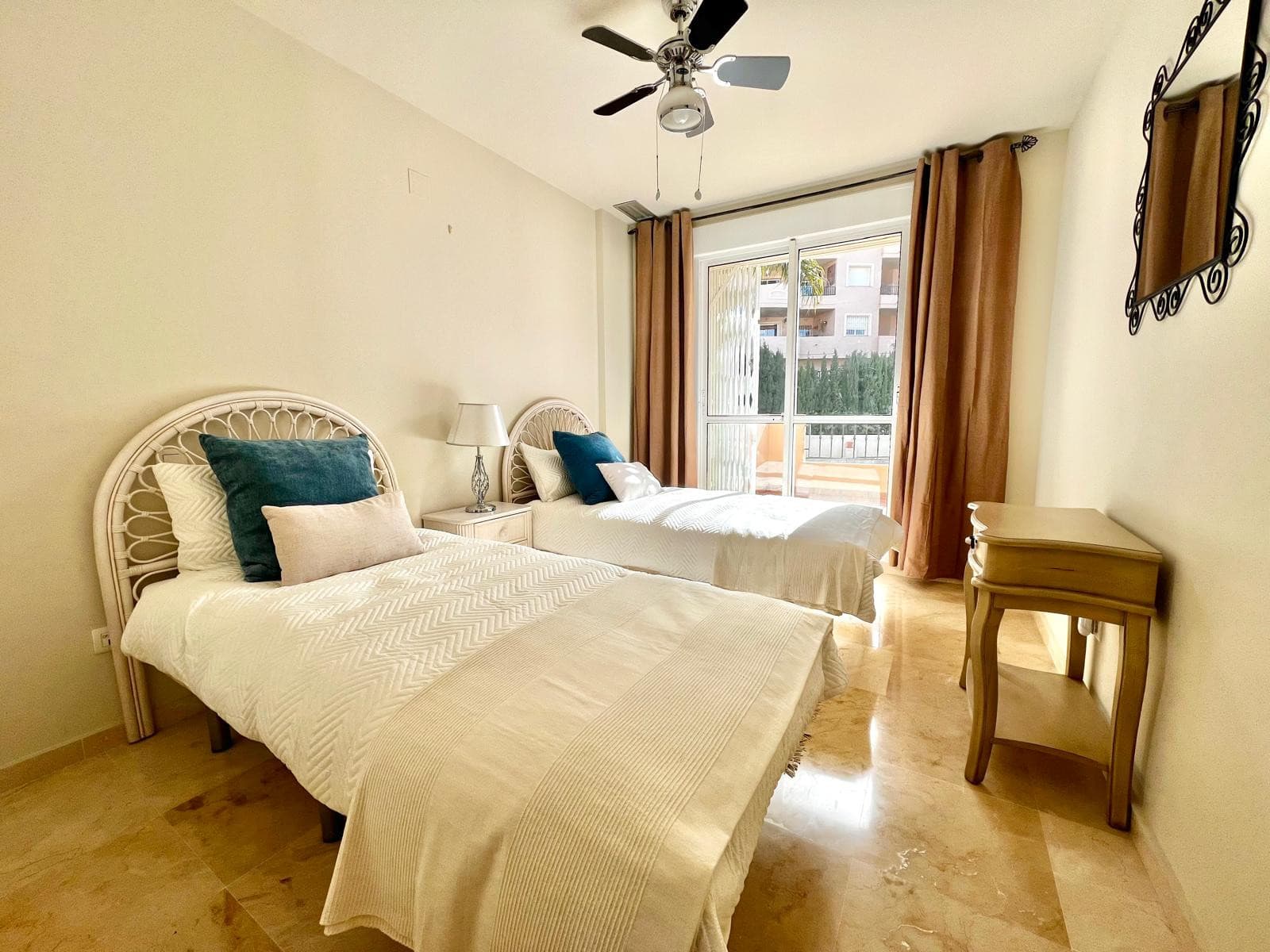 Stylish 2-bedroom apartment in Duquesa Fairways with two private terraces, golf views, and access to pools, gardens, and underground parking—just minutes from the marina and beach.
